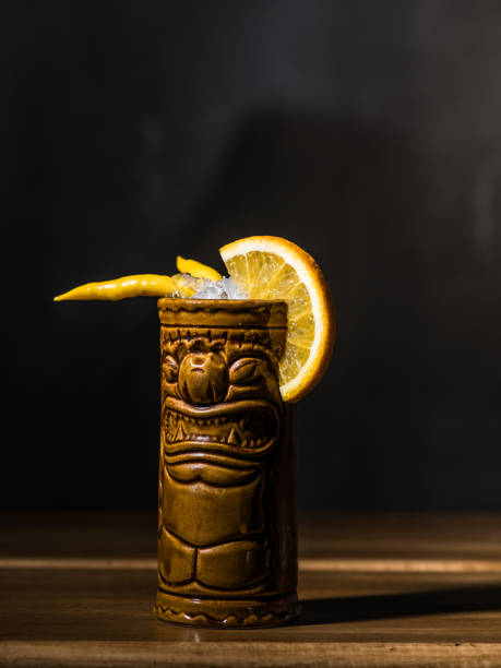 istock Exotic tropical tiki cocktails on a black background 875399172