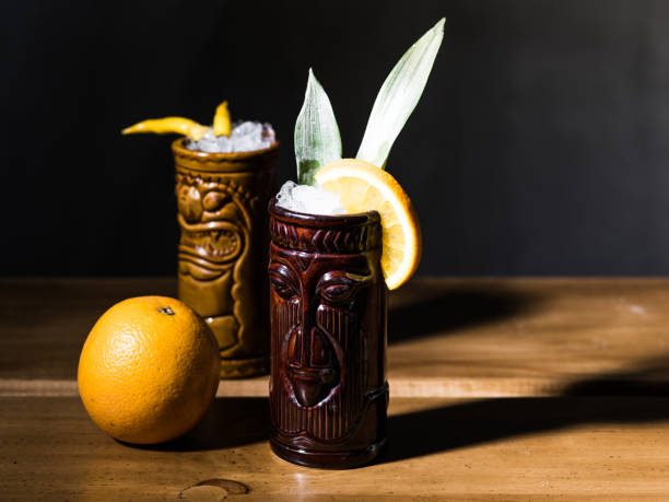 istock Exotic tropical tiki cocktails on a black background 875401514