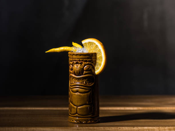 istock Exotic tropical tiki cocktails on a black background 875401798