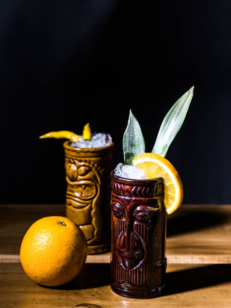 istock Exotic tropical tiki cocktails on a black background 875402076