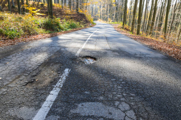 Big pothole on open road stock photo