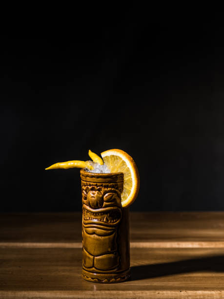 istock Exotic tropical tiki cocktails on a black background 875402924