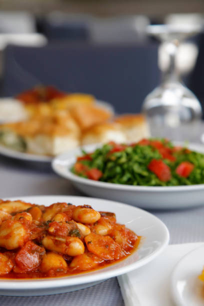 Baked beans, salad and pie for meal in restaurant table