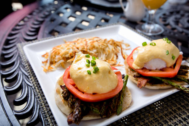 istock Breakfast of Eggs Benedict, Hash Browns and Asparagus 875415734