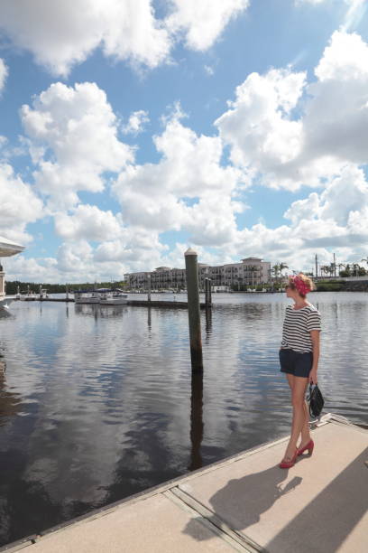 istock Pin-up girl on a pier. 875416904