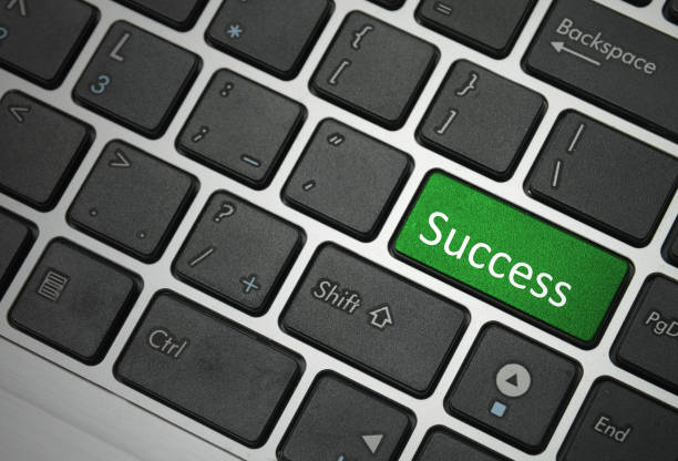 Cтоковое фото Компьютерная клавиатура - зеленый ключ Успех
