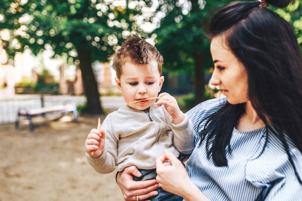 istock Mother with little son outdoor 875419522