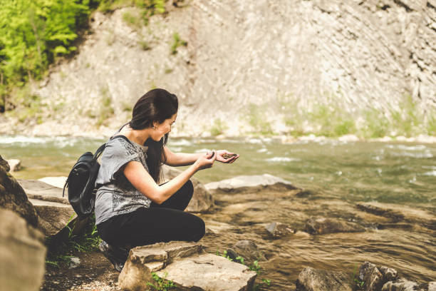 istock Woman with backpack in the mountains 875419672