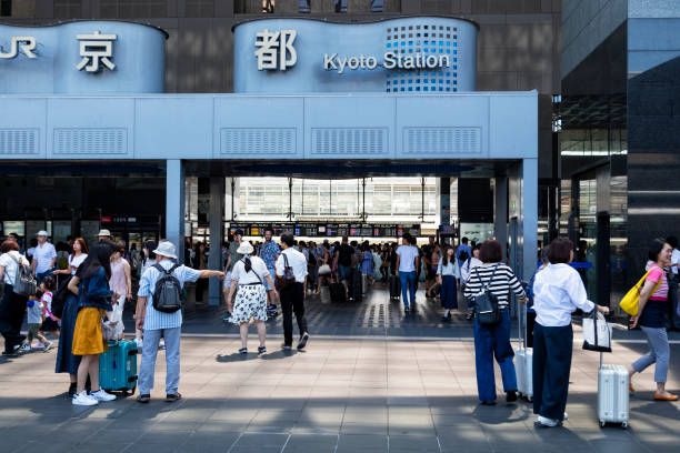 Rush hour, crowd of people walking at railway station in Kyoto, Japan