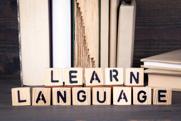 istock learn language, wooden letters on wooden table. Education, success and communication background 875426806