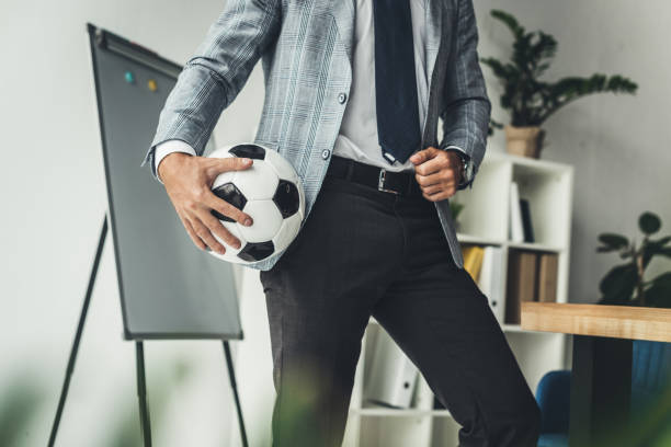 istock businessman with soccer ball 875426998