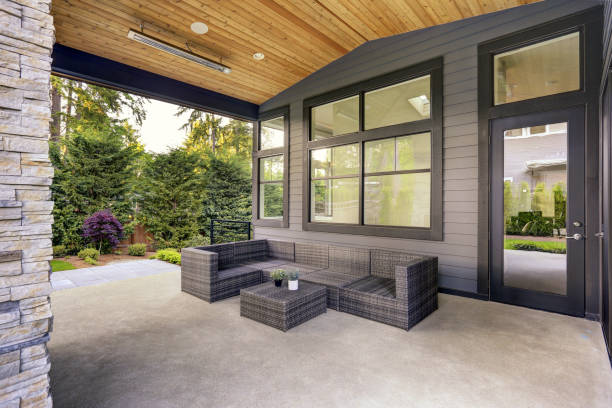 New modern home features a backyard with patio stock photo