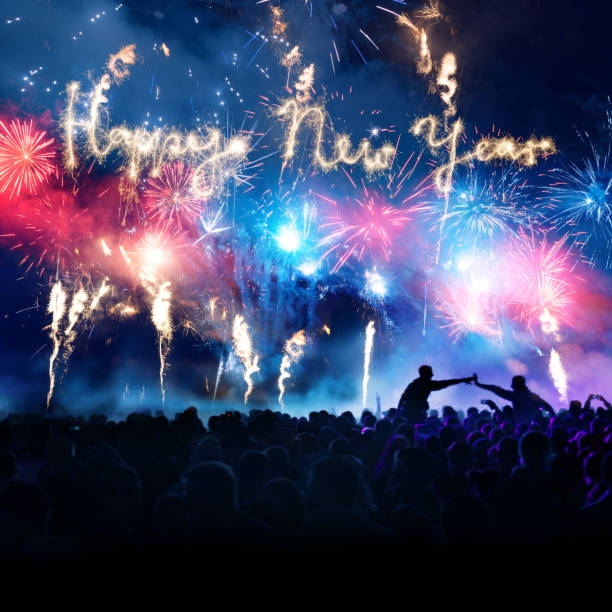 istock Firework Display With Celebrating People And Sparkler Happy New Year 875427308