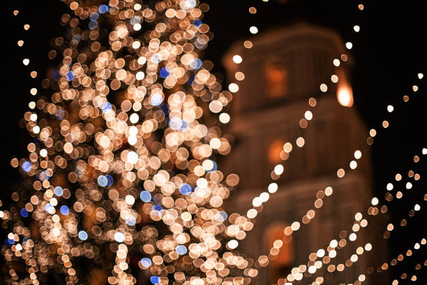Christmas tree on the main city square at night stock photo