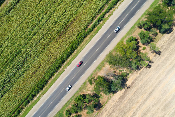 istock Aerial view of a highway passing through fields 875430394
