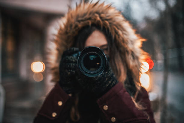 Female traveler taking photos with professional camera
