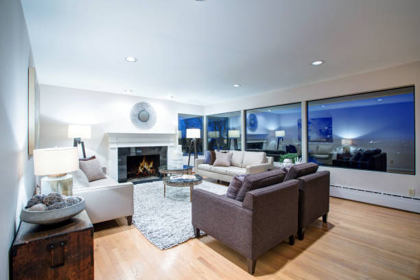 istock Warm light brown living room with panoramic window view. 875433704