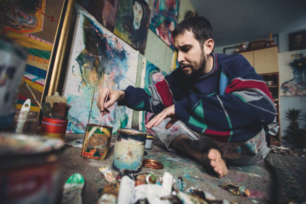 istock Artist man painting alone 875437132