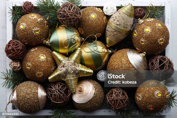 Golden Christmas Toys In White Wooden Box Stock Photo - Download Image Now - Abundance, Arrangement, Bead