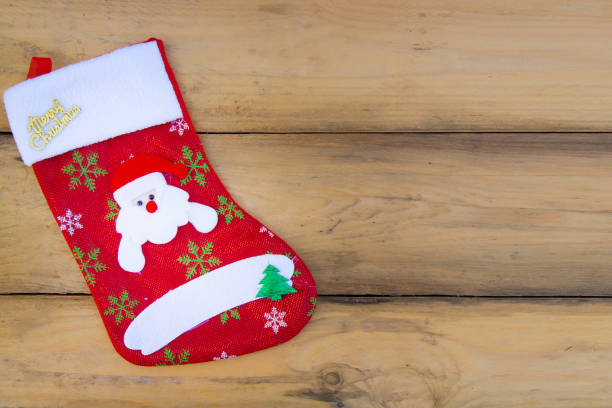 istock The sock Christmas on wood table image background 875447466