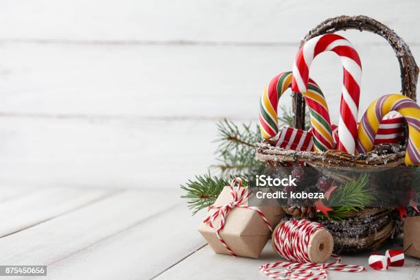 Christmas Basket With Candy Canes On White Planks Stock Photo - Download Image Now - Basket, Christmas, Christmas Present