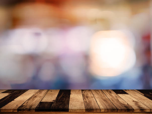 istock wood table with blurred interior in cafe background 875454314