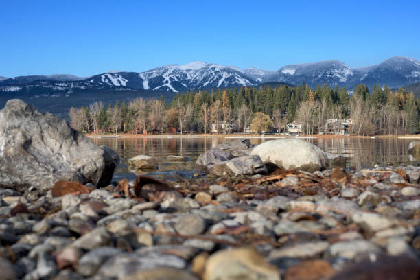 whitefish mountain resort viewed from the shores of whitefish lake in whitefish, montana - montana water landscape nature imagens e fotografias de stock