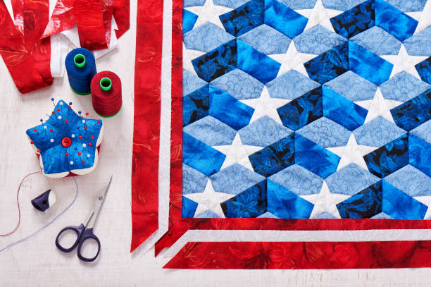 istock Sewing of quilt with stylized elements of American flag 875458126
