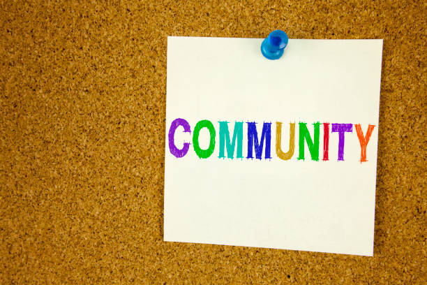 istock Conceptual hand writing text caption inspiration showing Community. Business concept for togetherness love written on sticky note, reminder cork background with copy space 875467240