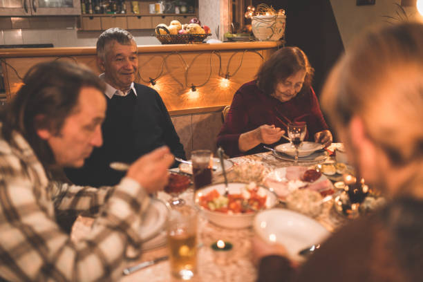 istock Family having dinner together during holidays 875467346