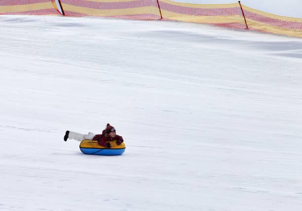 istock Snow tubing in ski resort 875468114
