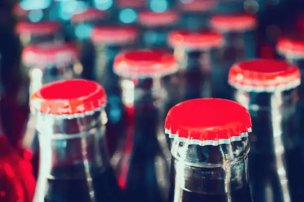 Photo of soft drinks in bottles background