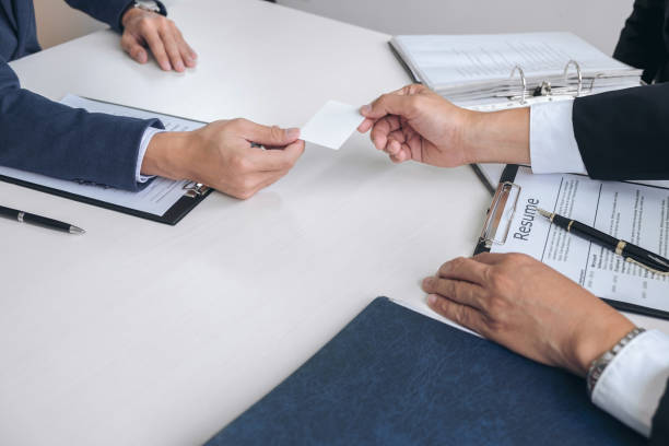 istock Interviewer or Board reading a resume during job interview, Employer interviewing a young male job seeker for recruitment talking in modern office and filing card, employment and recruitment concept 875471156