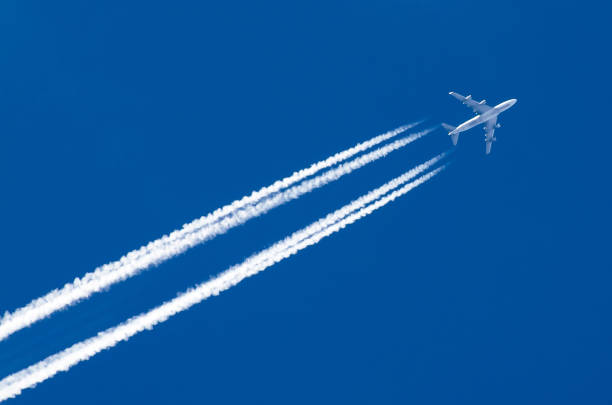 istock Airplane big two engines aviation airport contrail clouds. 875471316