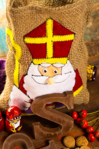 istock Traditional Dutch Saint Nicolas celebration with presents for children in December, Saint Nicolas  gift bag and chocolate letters 875480542