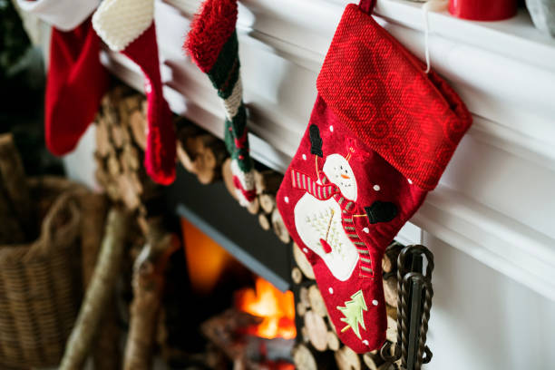 istock Christmas stockings hanging on a chimney 875481098