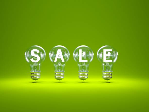 istock Sale and shopping concept. Light bulbs on green background 875493420