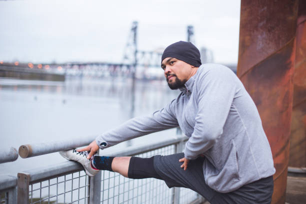 istock Man exercising outdoors in city 875496250