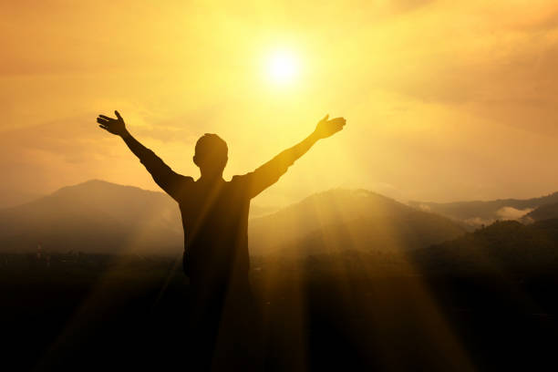 istock Men raise their arms up the sky 875499574
