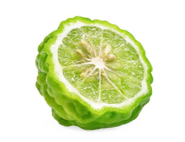 half cut of bergamot isolated on white background half cut of bergamot isolated on white background kaffir stock pictures, royalty-free photos & images