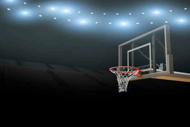 Basketball Stadium Arena Background A professional basketball stadium arena background with flares and basketball goal with copy space. college basketball court stock pictures, royalty-free photos & images