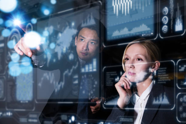 Two business persons in front of futuristic display. Graphical User Interface(GUI). Head up Display(HUD). Internet of things. Two business persons in front of futuristic display. Graphical User Interface(GUI). Head up Display(HUD). Internet of things. communication occupation business chart stock pictures, royalty-free photos & images