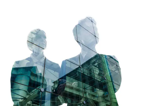 Photo of Double exposure of business person and cityscape.