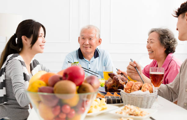 istock Happy family having dinner together 875508660
