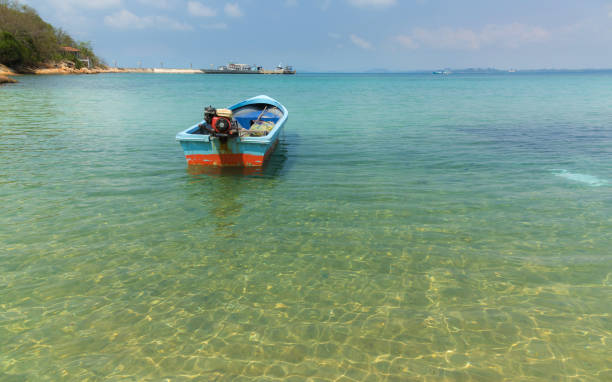 istock Clear view at beach with fisher boat 875514556