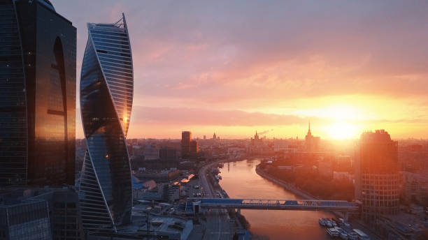 Flying over Moscow International City Business Center at sunrise Flying over Moscow International City Business Center at sunrise moscow city stock pictures, royalty-free photos & images
