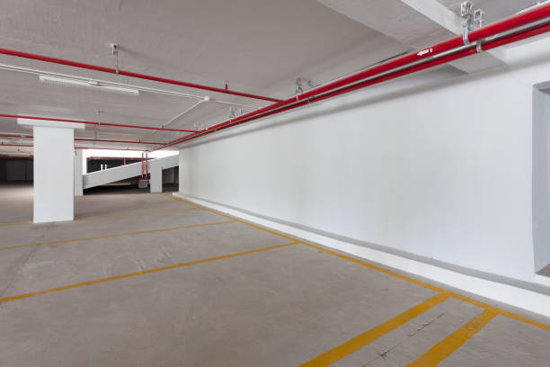 istock Empty parking garage underground interior in apartment or business building office. 875514978