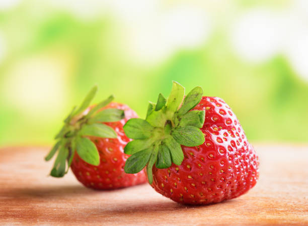 istock Fresh ripe red strawberries on wooden board 875517392
