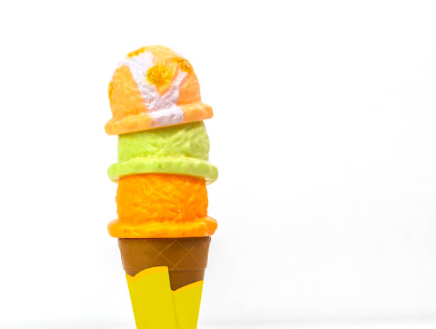 istock Plastic Children Toy,  three mixed ice cream scoop in waffle. Isolated white background 875517480