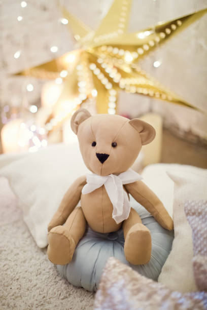 istock Teddy bear near Christmas decorations 875521324